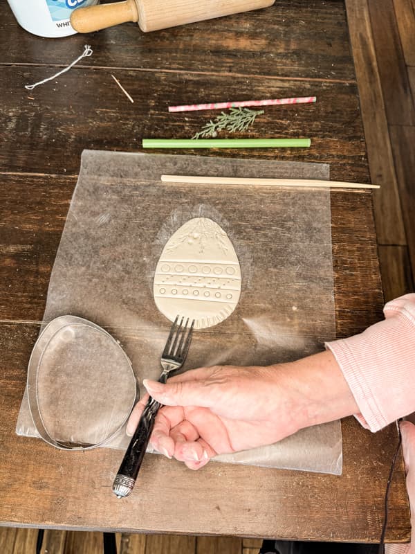 Press Fork into soft clay to make designs