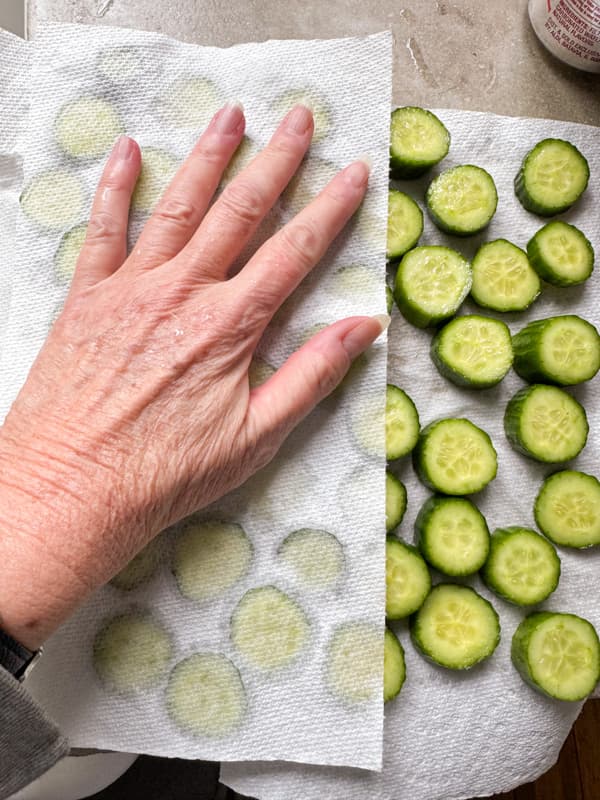 Pat cucumbers dry with paper towels. 