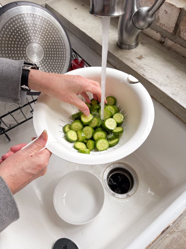 Rinse cucumbers with cold water