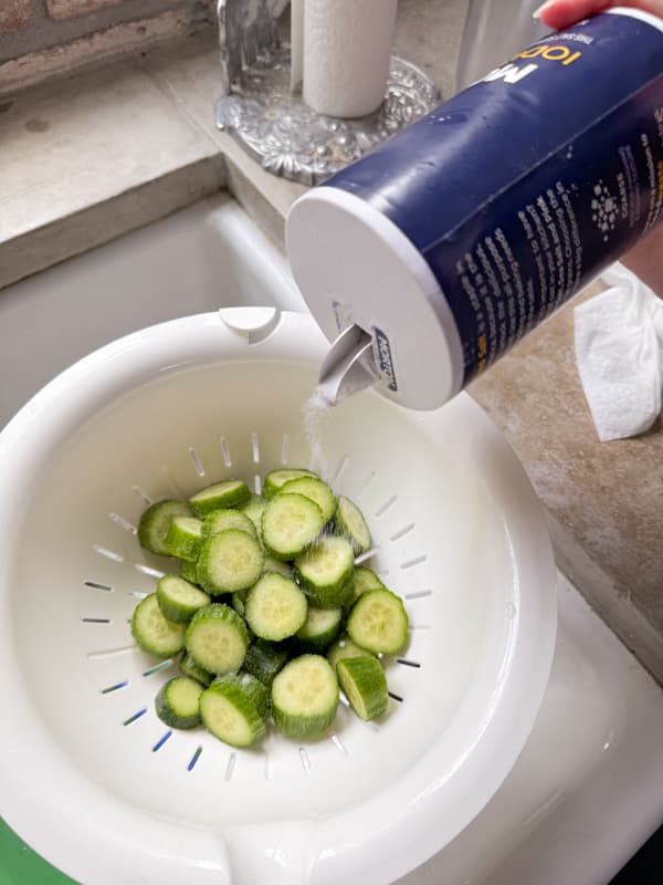 Spring cucumbers with salt to drain.