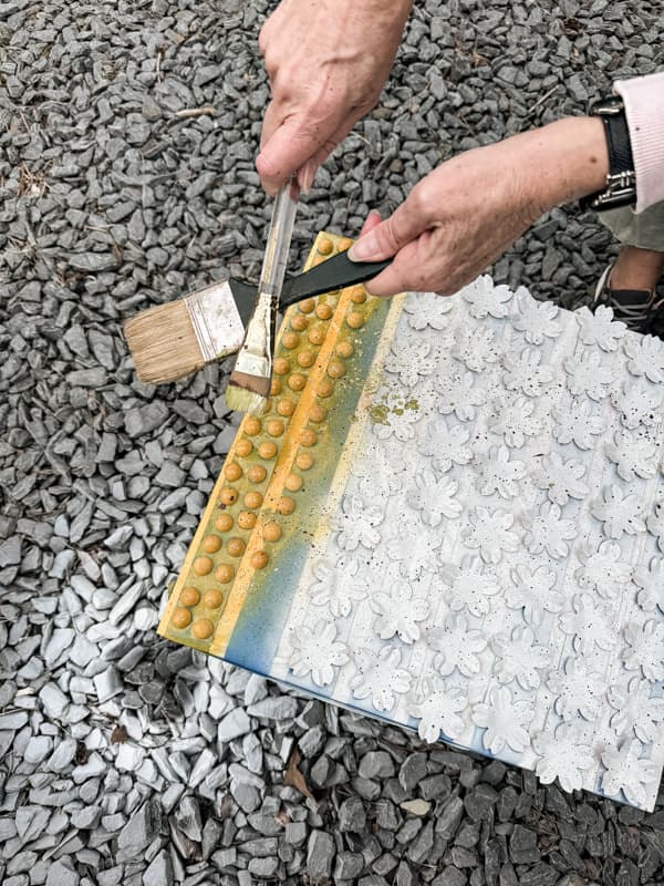 Speckle the flowers with craft paint for a rustic DIY wreath.