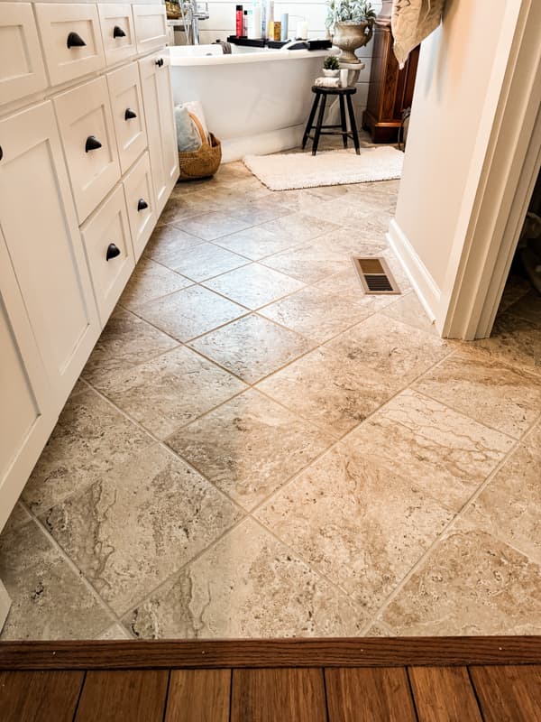 neutral floor tiles for a modern bathroom aesthetic. 