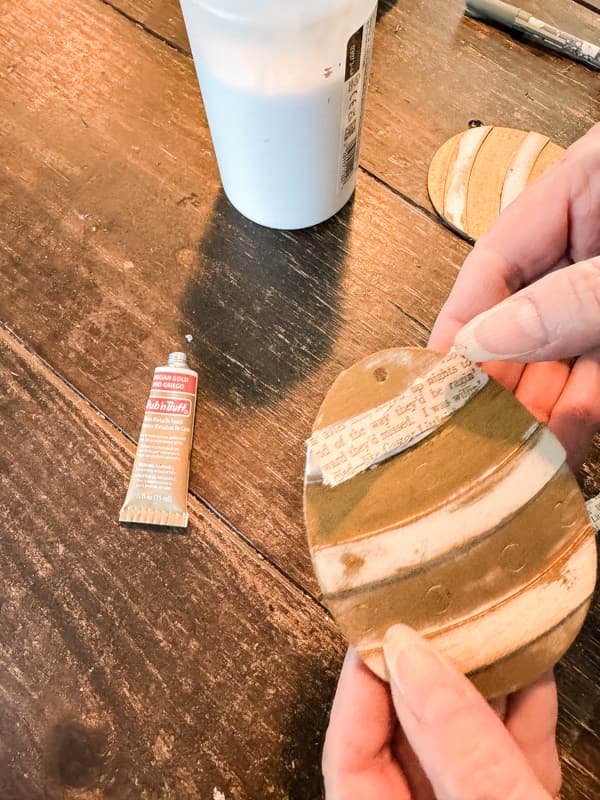 Add Old Book Pages to Wooden Easter Eggs with decoupage technique.  