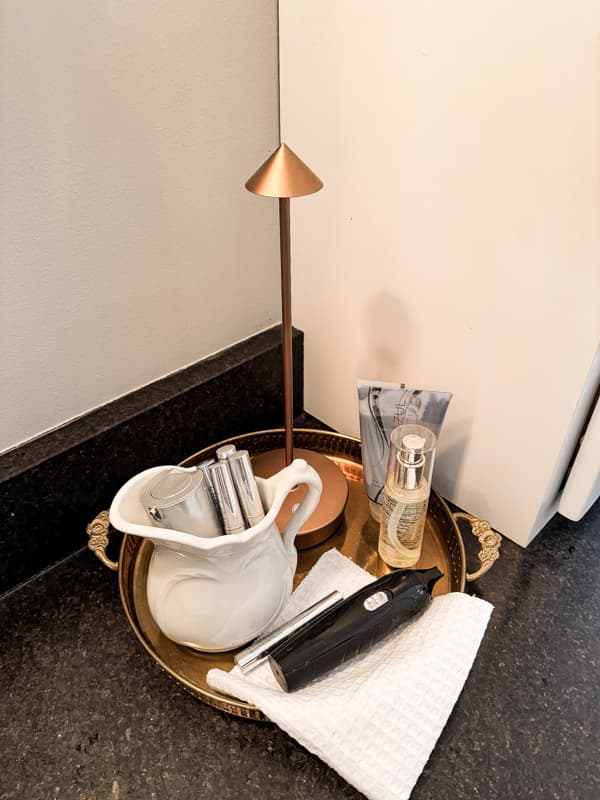 Vintage brass tray and ironstone pitcher for vintage bathroom decor ideas.  