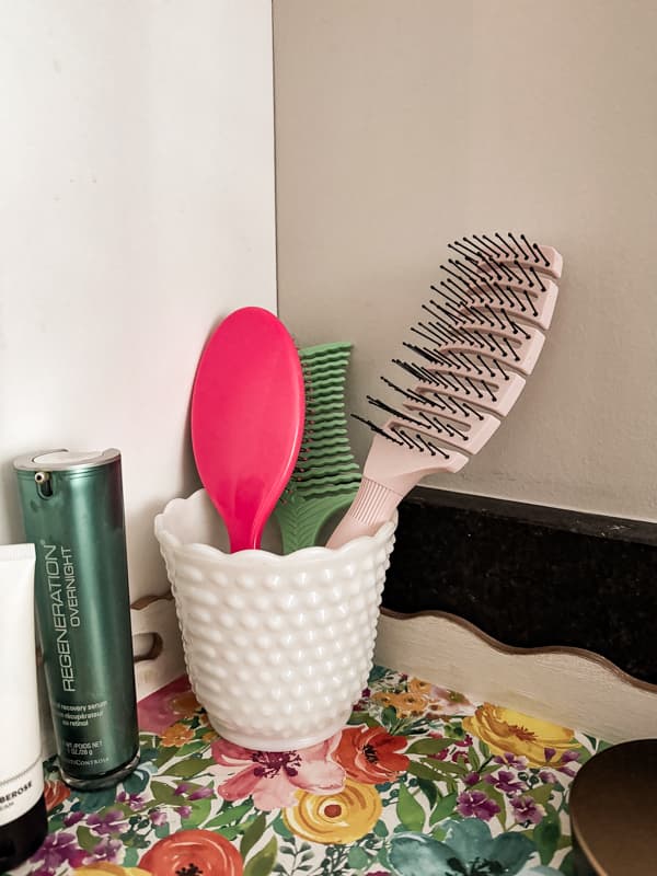 hobnail milk glass vase for vintage bathroom decor accessories in a modern bathroom.