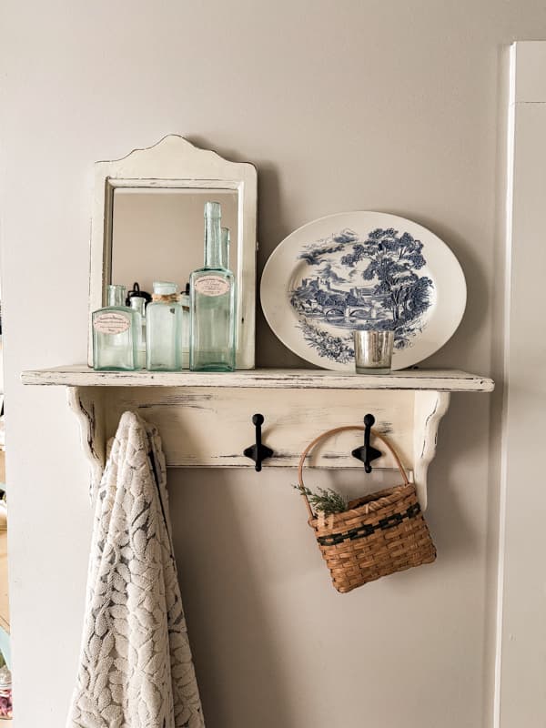 Thrift store finds - old mirror and wall shelf transformed with chalk paint.  