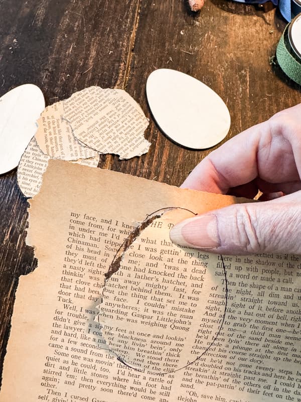 Cut old book pages in shape of eggs