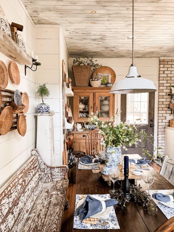 Farmhouse kitchen hutch with collections of baskets and cheese boards.  