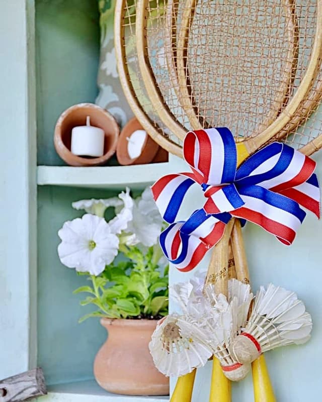 Vintage badmitton rackets and birdies make a stunning wreath for Springtime.  