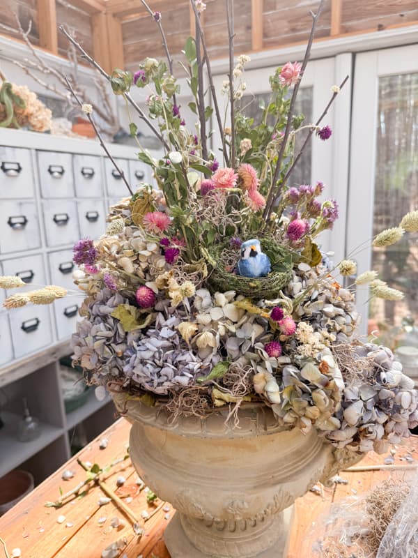 DIY Dried Flower Arrangement with bird and nest, dried hydrangeas, twigs and grapevine for how to dry flowers.  