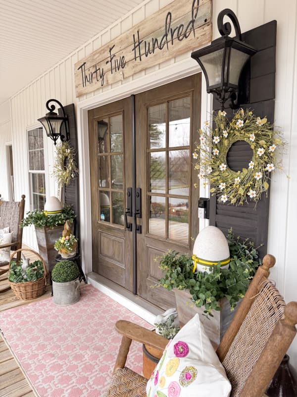 DIY Easter Decorations for outside on country farmhouse porch with DIY planters, wreaths and Easter Eggs.  