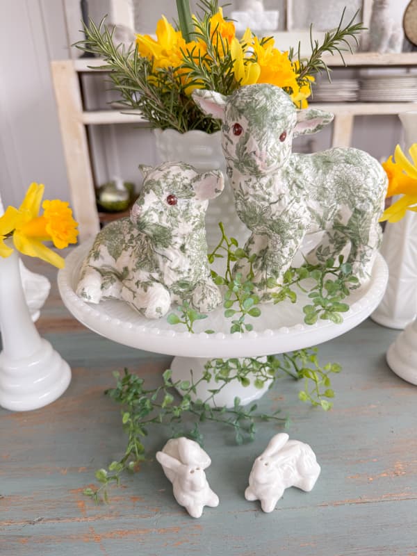 DIY thrift store Easter Lamb with napkin decoupage for Easter table centerpiece on milk glass cake stand.