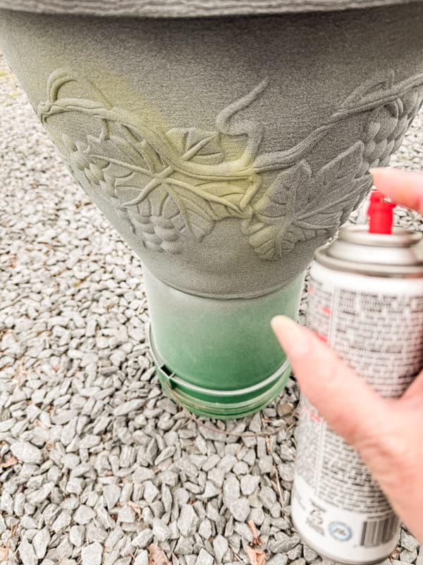 randomly spray the free resin planters with green paint.  Rustic Farmhouse Style faux concrete pots. 