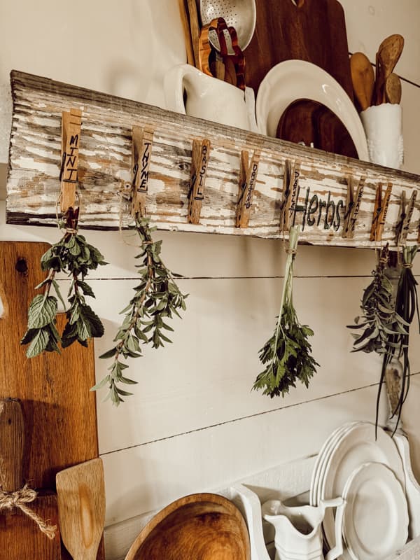 DIY Herb Drying Rack made with reclaimed shiplap and vintage clothespins.  
