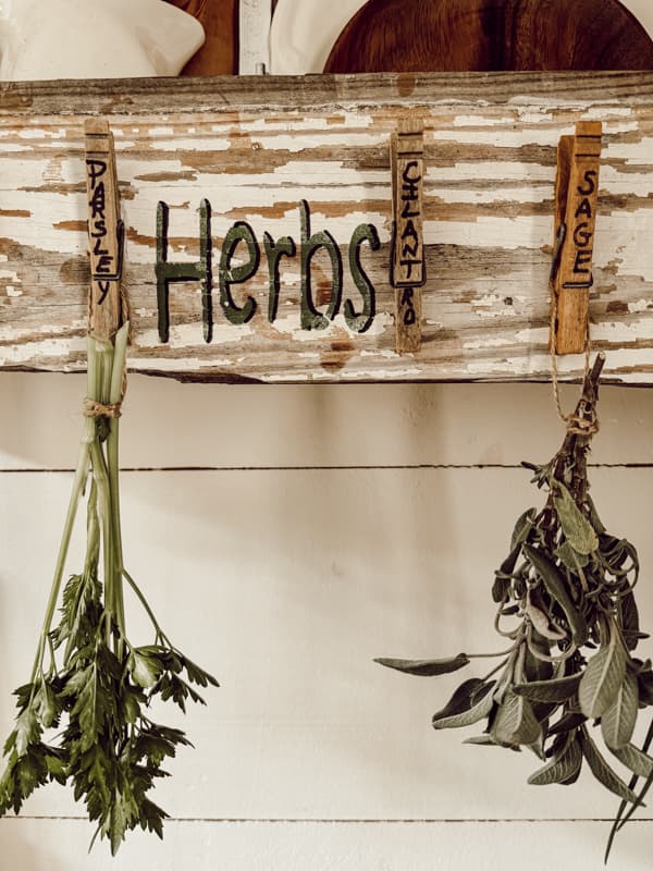 DIY Herb Drying Rack made with reclaimed wood and vintage clothespins.  