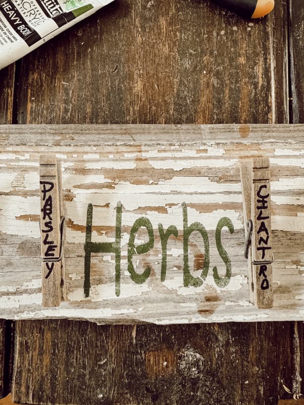 Stencil the word HERBS to the center of the DIY herb drying rack.  