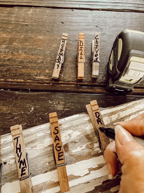 Hand print the herb names on the clothespin with black sharpie marker