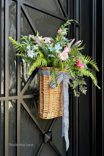 Springtime wreath basket on front door.  