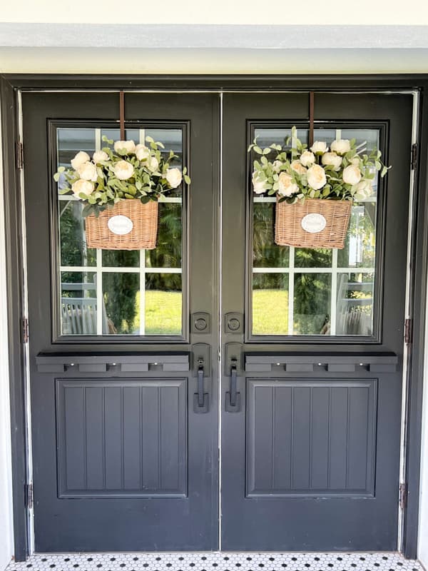 French doors with basket wreaths and flowers.  