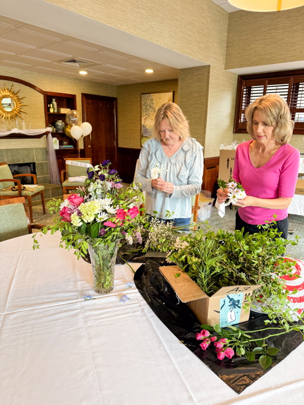 Putting together flower arrangements for bridal shower