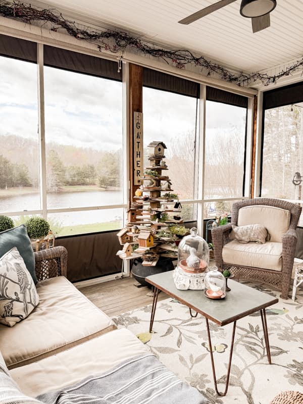 Spring Screened Porch with handcrafted coffee table and DIY shiplap tree for decor.