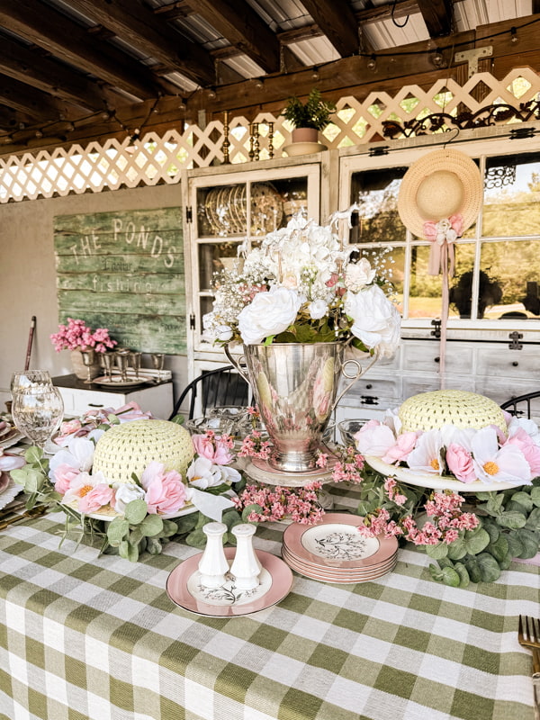 Derby Day Centerpiece ideas with Dollar Tree hats and flowers with a silver trophy centerpiece.