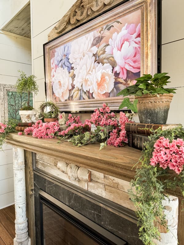 Pink Azaleas fill the mantel with DIY topiaries and old books