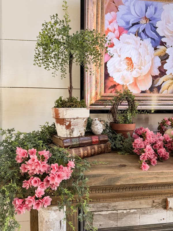 DIY Flower Pot and topiary on vintage books with bird and pink azaleas.  Farmhouse decor for spring