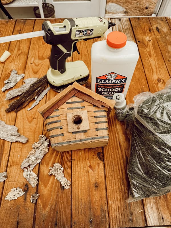 Old Birdhouse from a thrift store and other supplies to makeover the cheap birdhouse. 