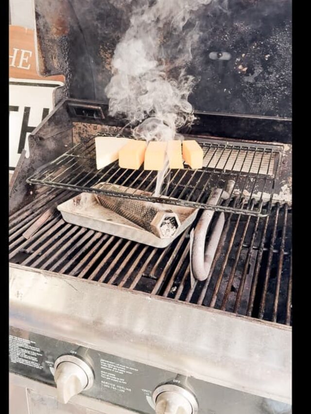 Cheese being smoked in grill using a smoker tube.