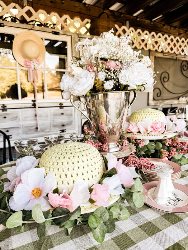 Kentucky Derby tablescape with roses and winners cup vase.