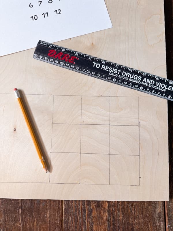 Use ruler and pencil to draw the grid for the DIY Kentucky derby party games