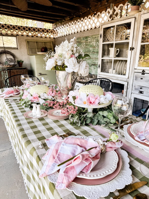 Kentucky Derby Party Ideas and tablescape with pink and green.  Silver trophy centerpiece and hats with roses.  