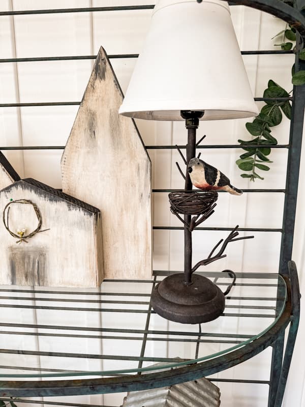 Spring Bird Lamp on bakers rack in screen porch