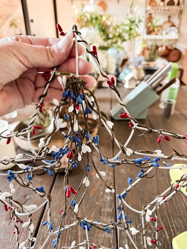 Add red, white and blue beaded garland to make a patriotic wreath with a frame from Dollar Tree