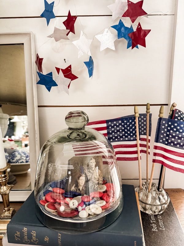 Cloche with vintage buttons, flags in vintage flower frog and DIY star garland