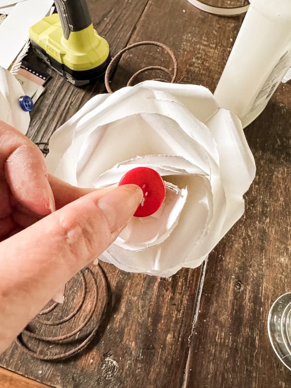 DIY button crafts with paper roses and red buttons.  