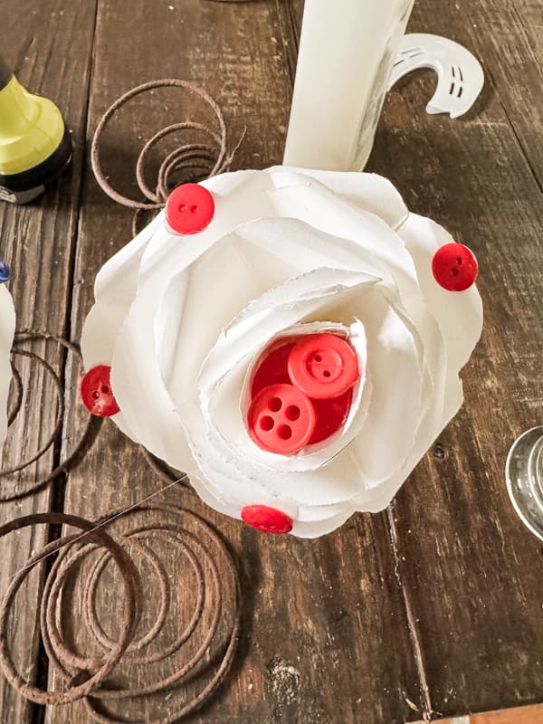 DIY button crafts with paper roses and red buttons.  