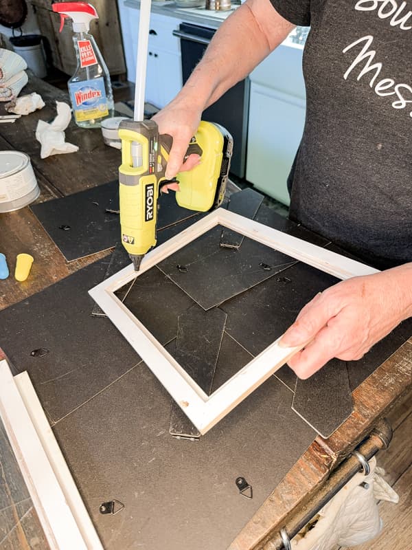 Add hot glue to hold window in picture frame to make a glass terrarium.  