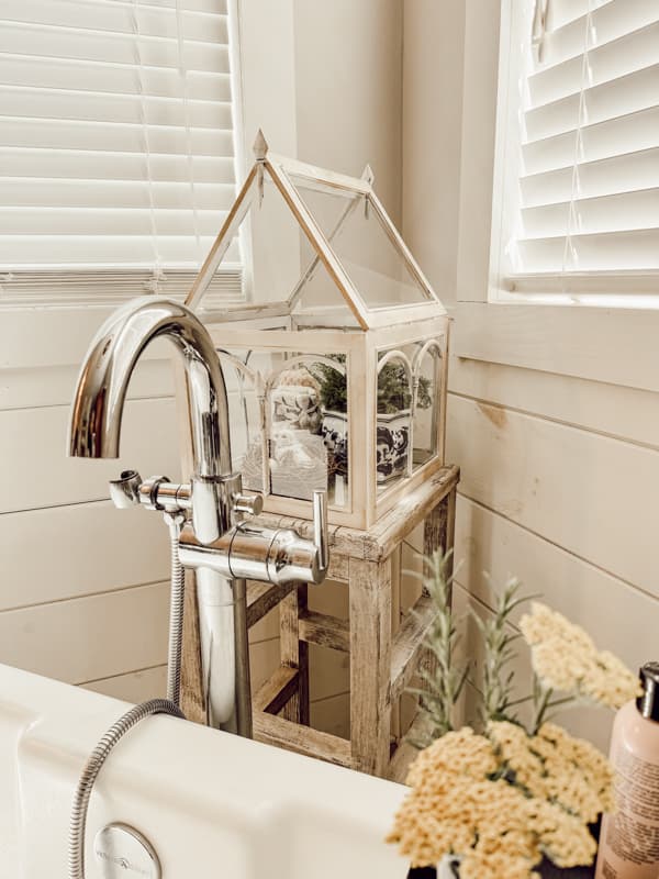 Glass Terrarium in bathroom on Thrifted bar stool painted white.  