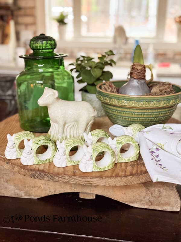 Thrifted lamb and bunny & cabbage napkin rings on kitchen island