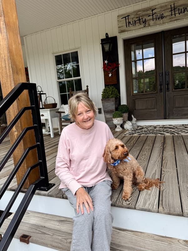 Rachel with short hair again and Rudy on front porch