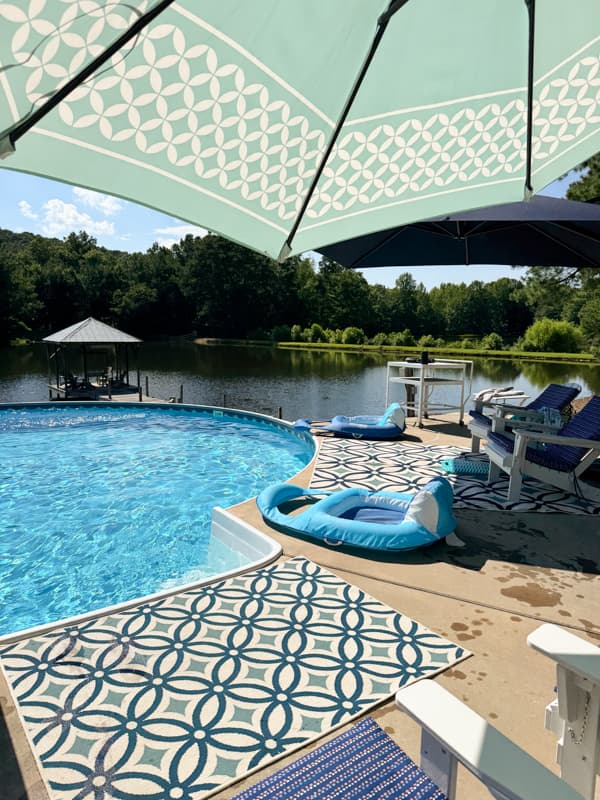 pool view with ponds and pier in background