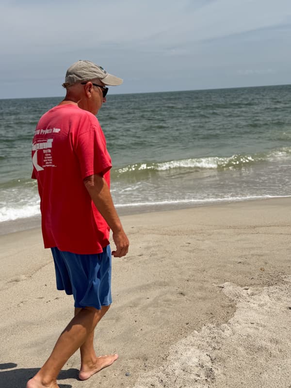 Brad walking on the beach