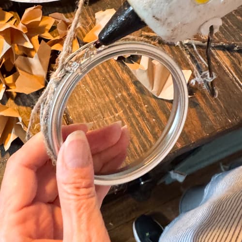 adding hot glue to canning jar ring