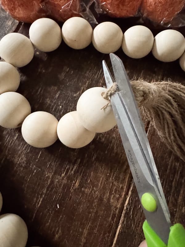 cut the tassels from the bead garland to remove beads