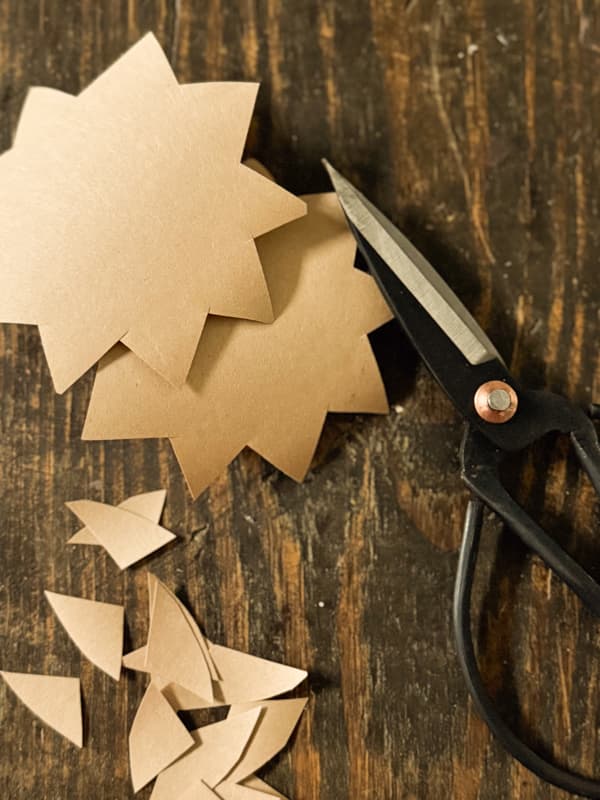 zigzag cuts around edges of craft paper circles