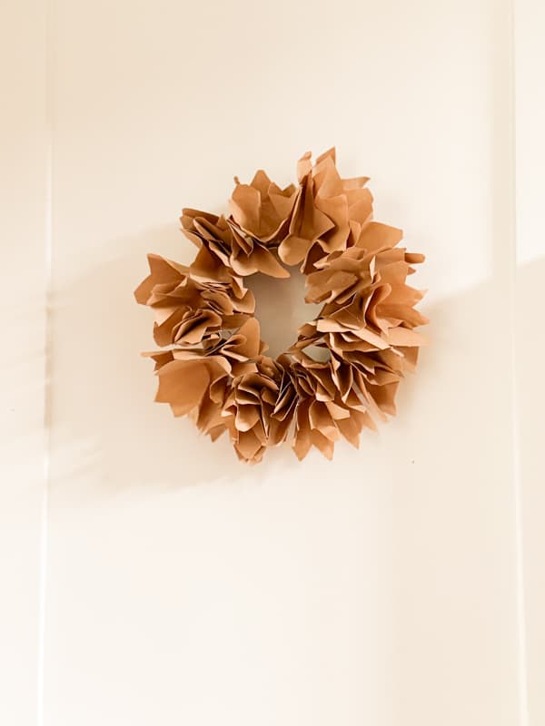 mini wreath attached to door with double stick tape