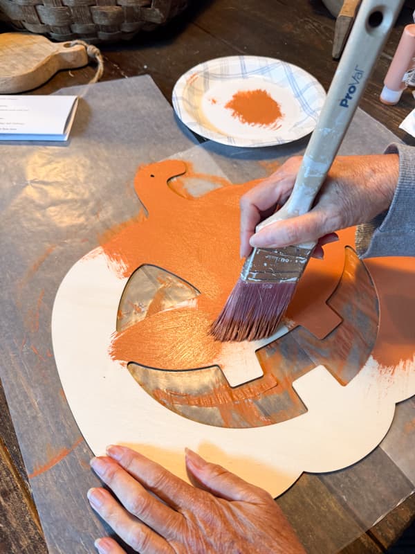 Paint Dollar Tree Jack o lantern with terra cotta paint