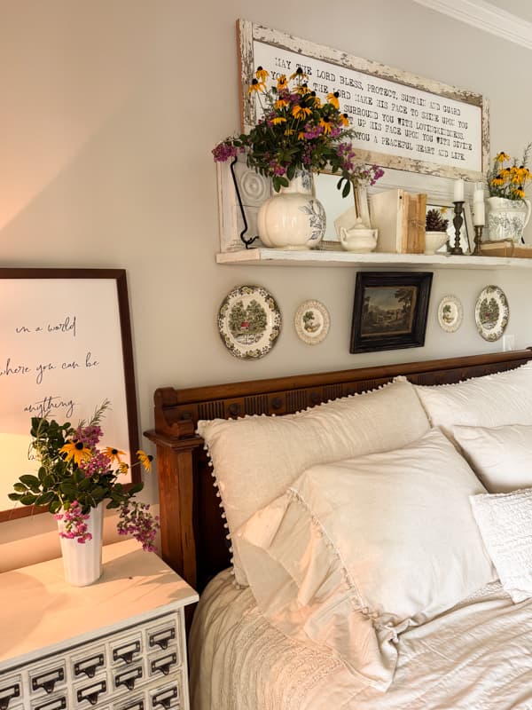 repurposed mantel shelf with thrift store finds and garden flowers for fall decorations